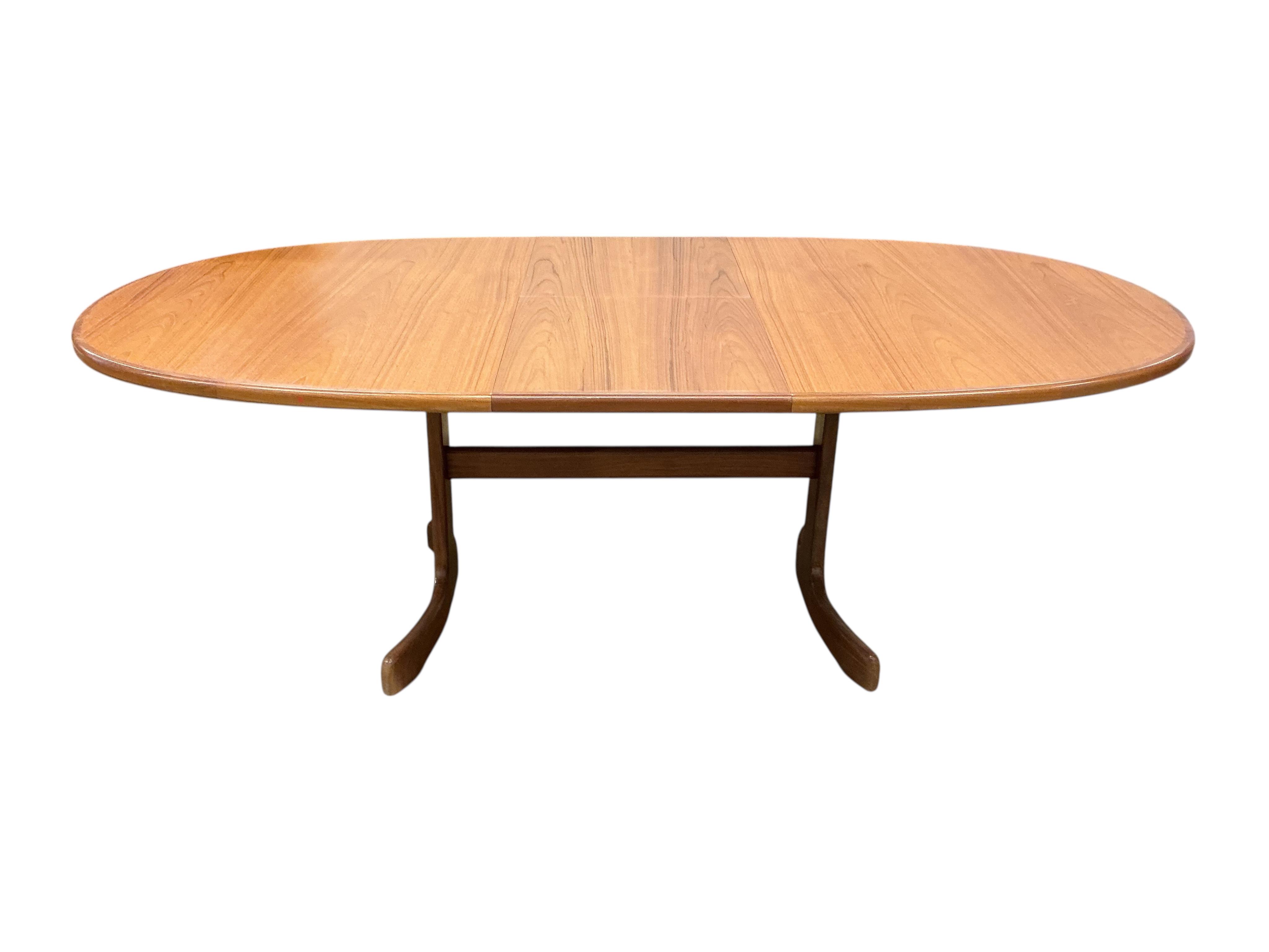 A mid century G plan teak extending dining table, width 162cm, depth 106cm, height 72cm together with a set of six chairs